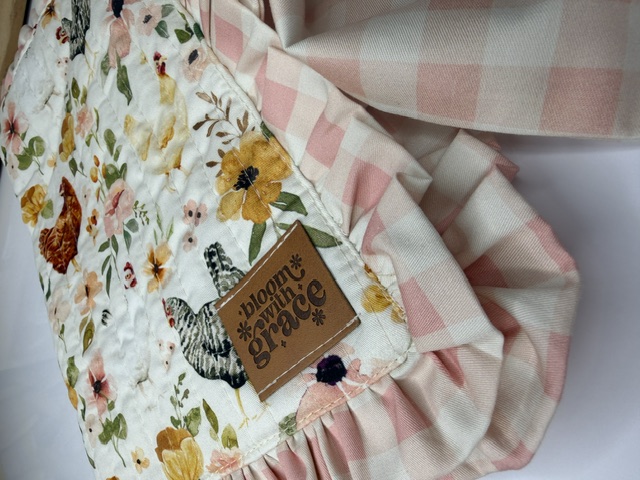 Close-up of quilted cotton journal cover showing hen and floral print with blush gingham ruffle โ Bible covers, journal covers, handmade unique gifts